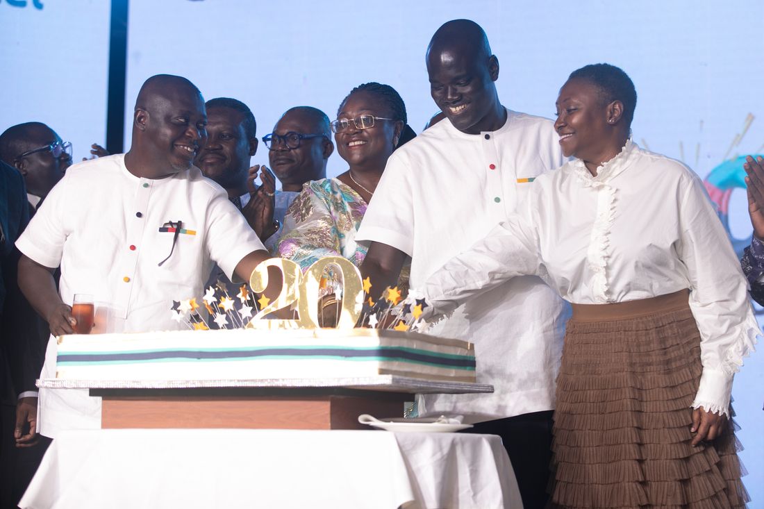 Smiles around the anniversary cake