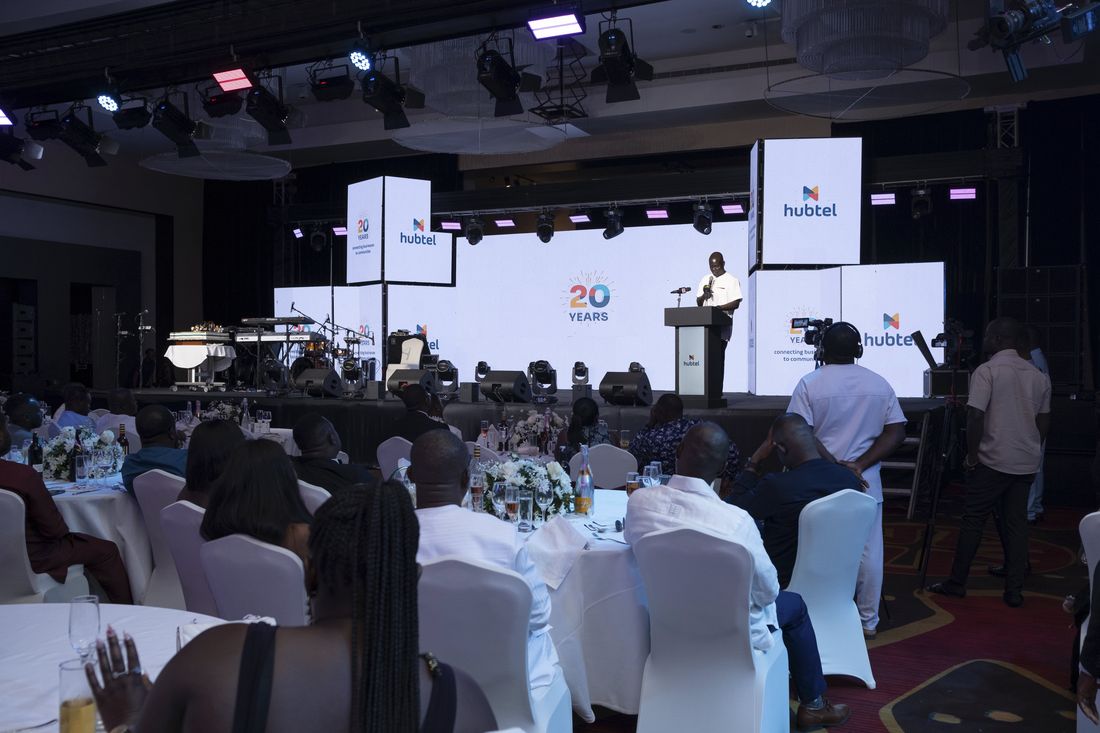 Wide view of the stage and 20 Years screens during the speech